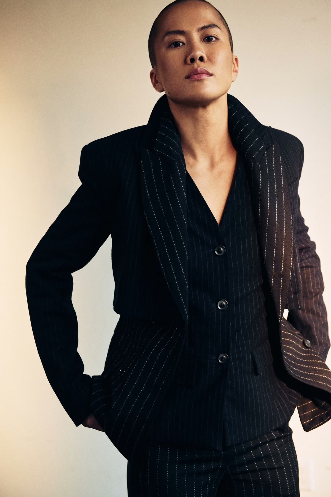 Tina Pham seated in a black blazer, looking directly at the camera